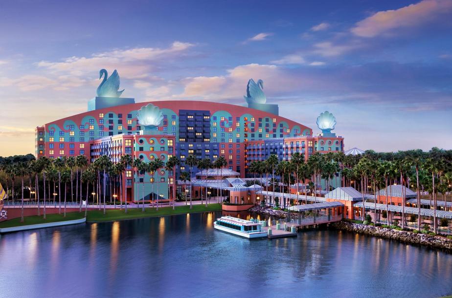 a large building with swans on top and a body of water