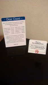 a sign and a card on a table