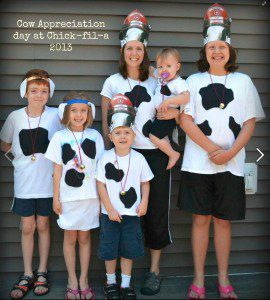 a group of people wearing cow clothing