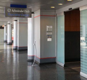a hallway with a sign and columns
