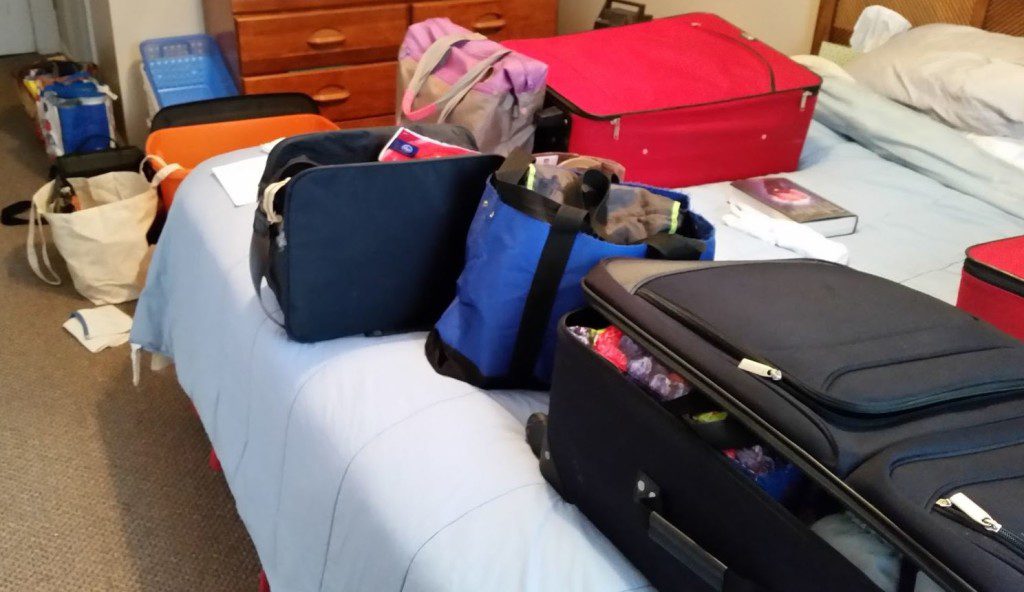packing-for-a-surprise-trip-bed