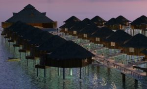 a group of huts on stilts in water