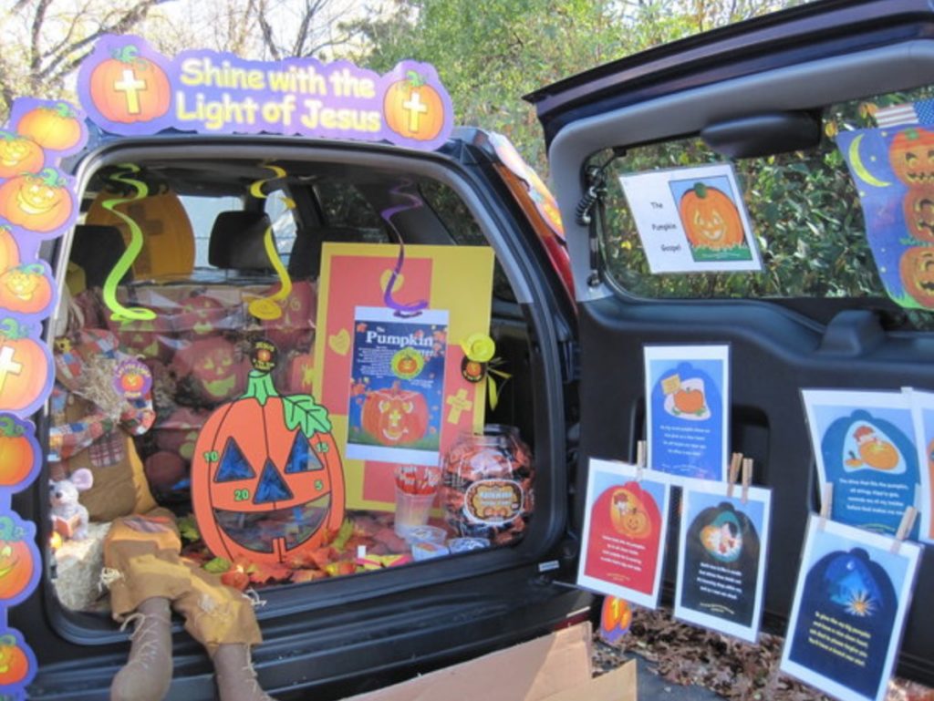 a car trunk full of pumpkins