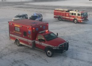 a group of ambulances parked in the snow
