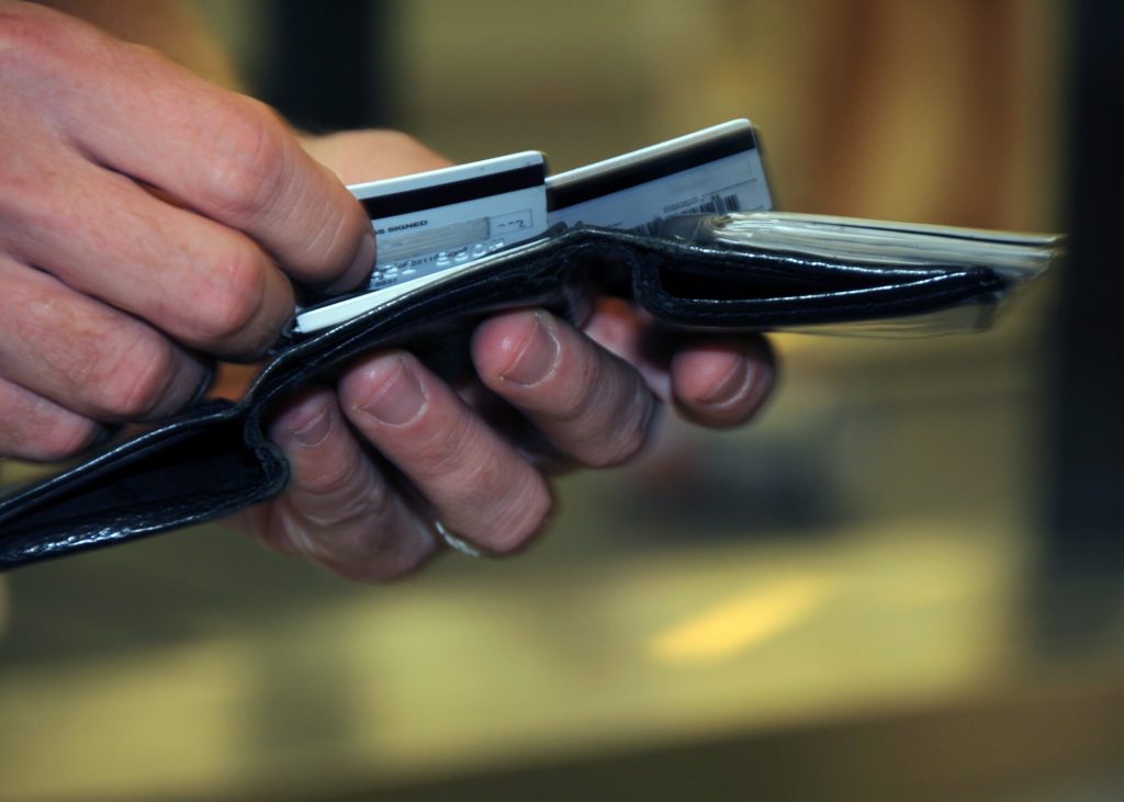 a person holding a wallet