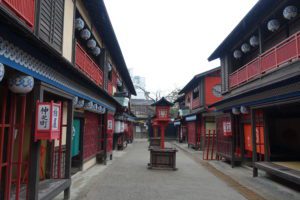 a street with red and blue buildings