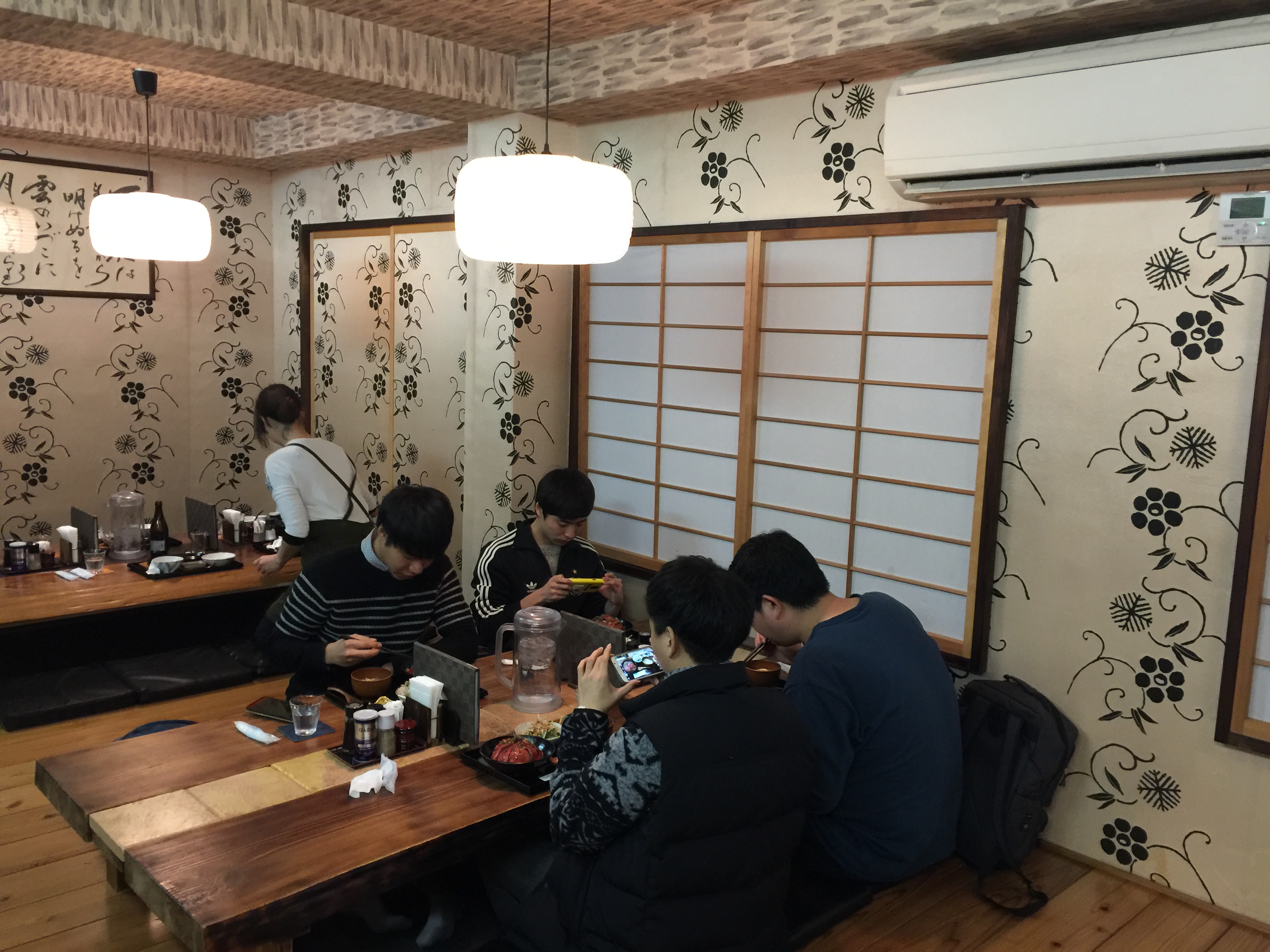 The main dining area has 3 tatami table that sits 6 people each