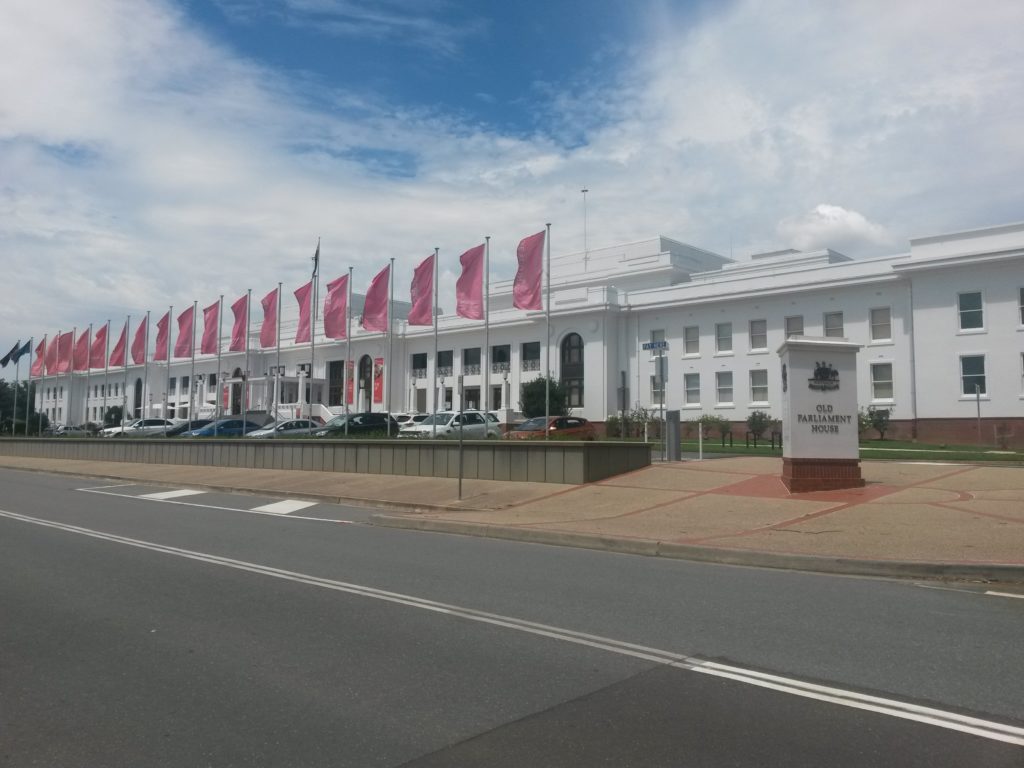 a white building with flags on it