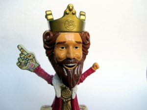 a toy figurine with a crown