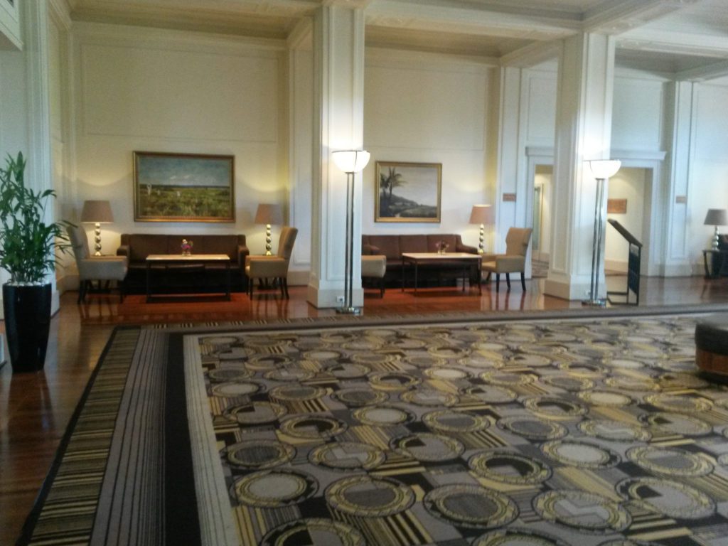 a large room with a large carpet and a large table