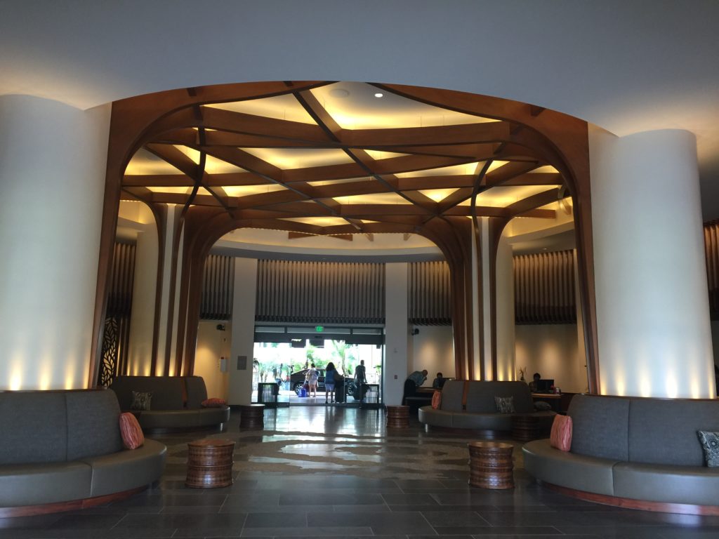 a lobby with a large ceiling and a large archway