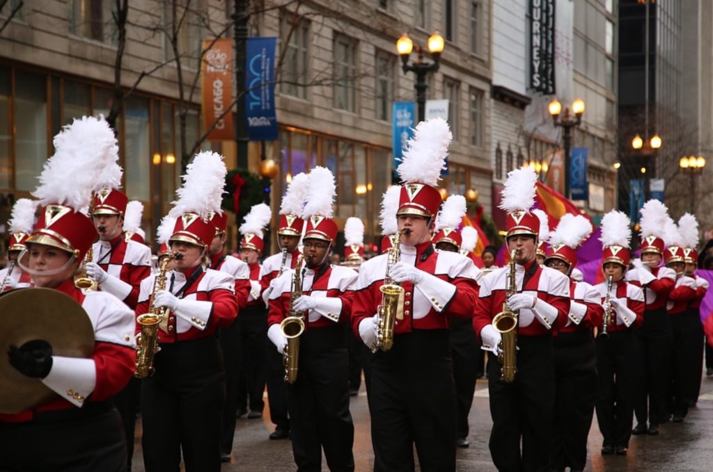a group of people in a marching band