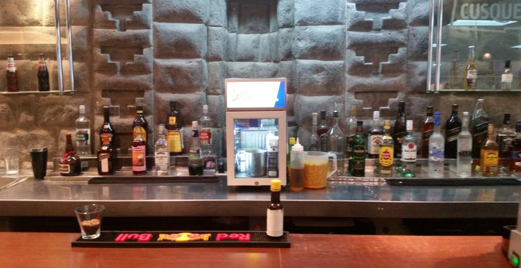a bar with bottles of alcohol