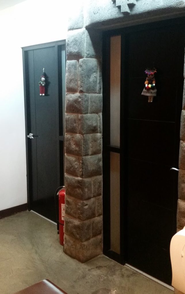 a stone pillar in a room