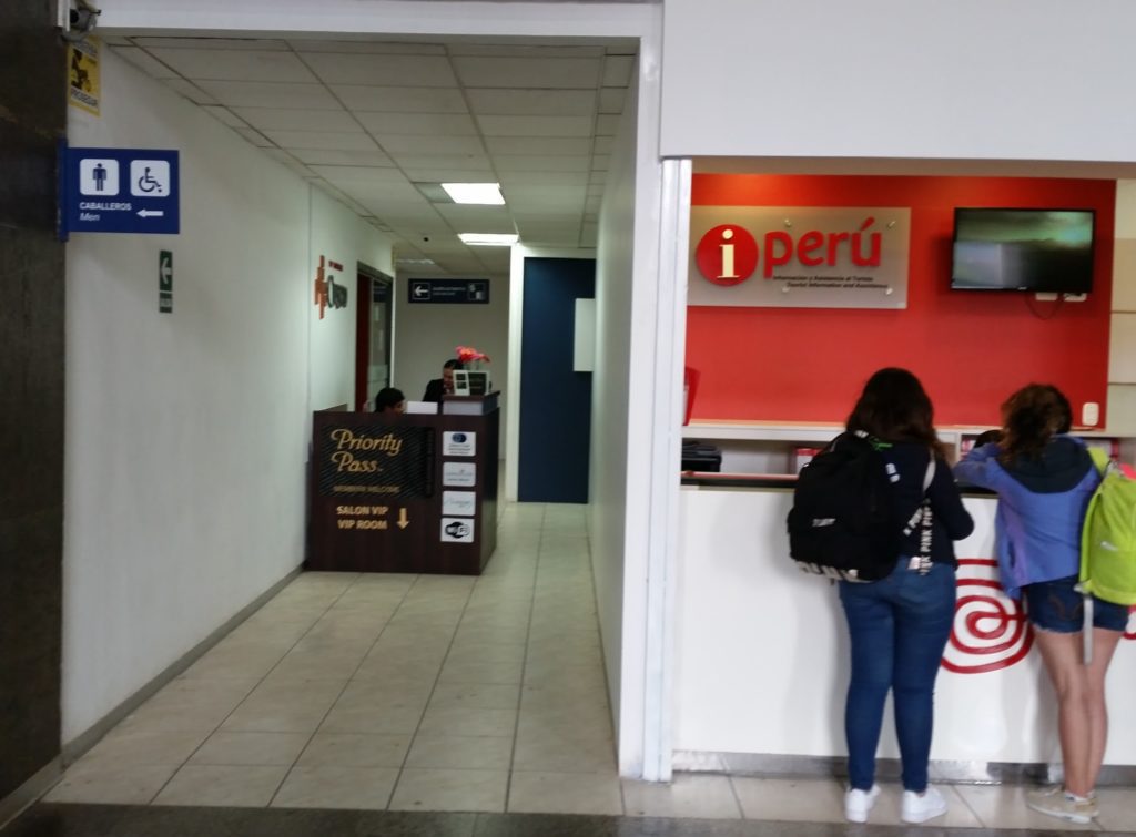 a woman standing at a counter in a building