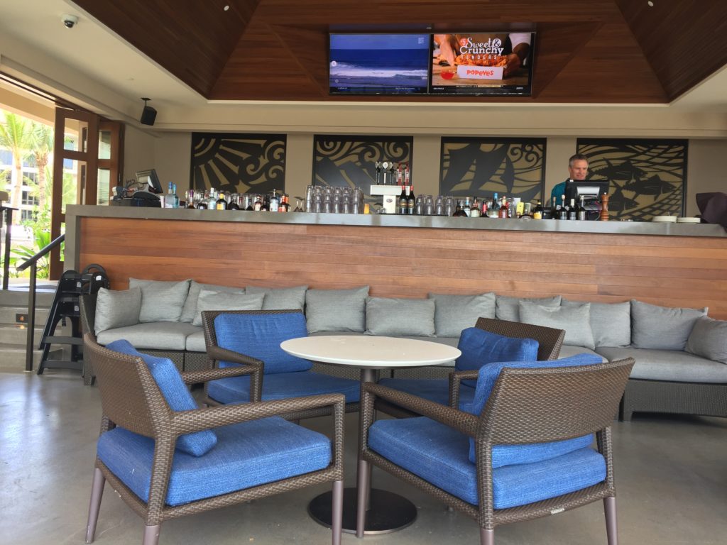a bar with a table and chairs