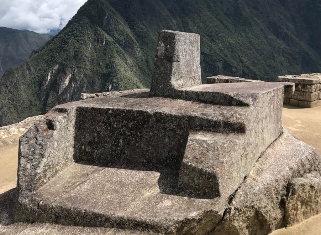 a stone structure on a mountain
