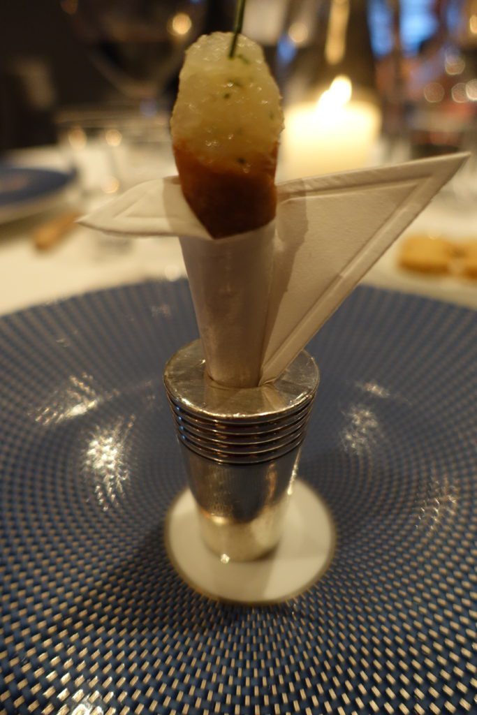 a piece of food on a napkin holder