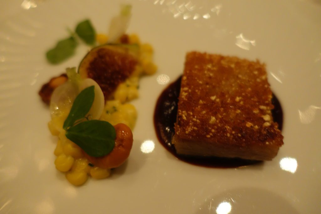 a plate of food on a white surface