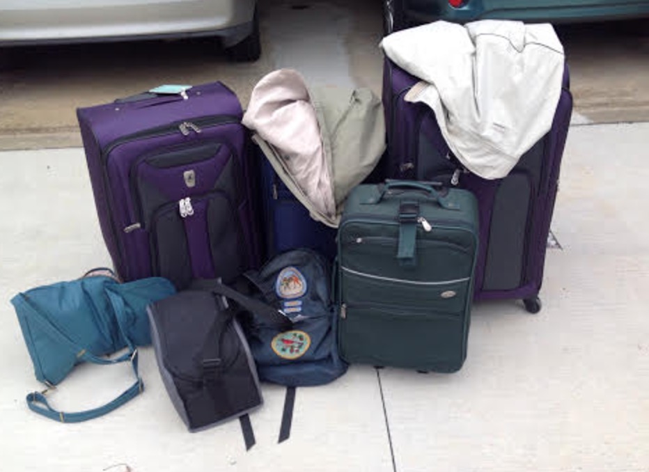 a group of luggage on the ground