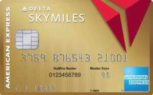 a credit card with a red and gold design