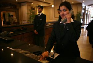 a woman in a suit talking on a phone