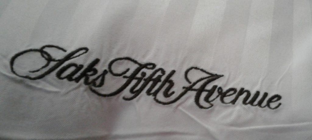 a close up of a white fabric with black text