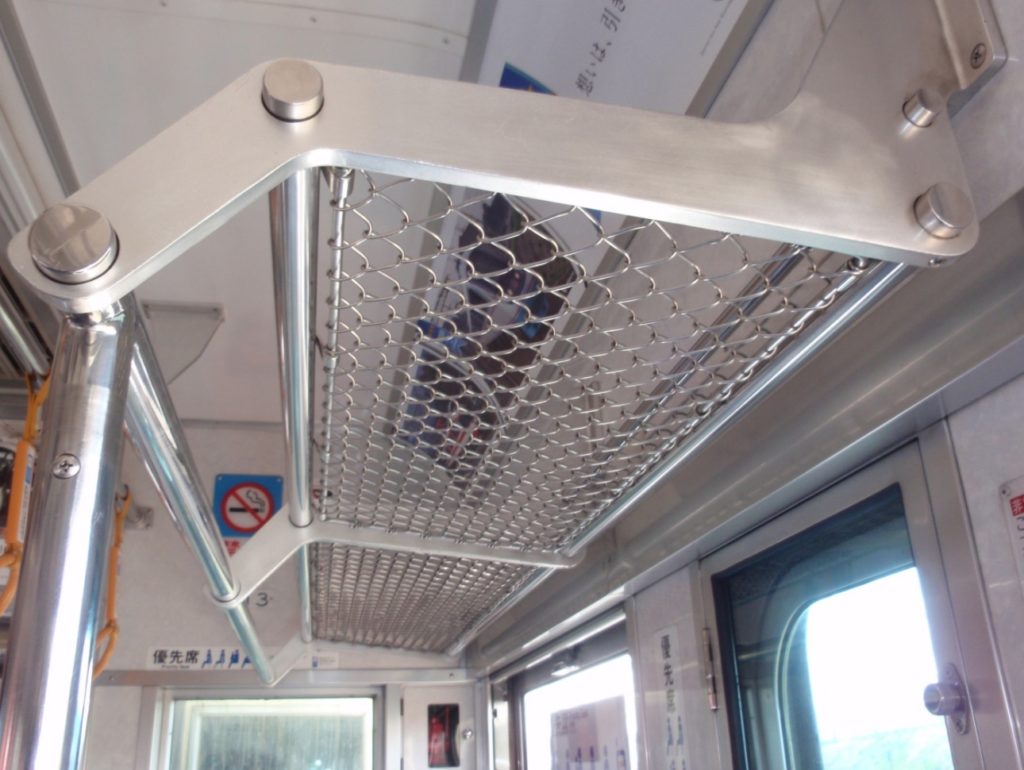 a metal rack on a train