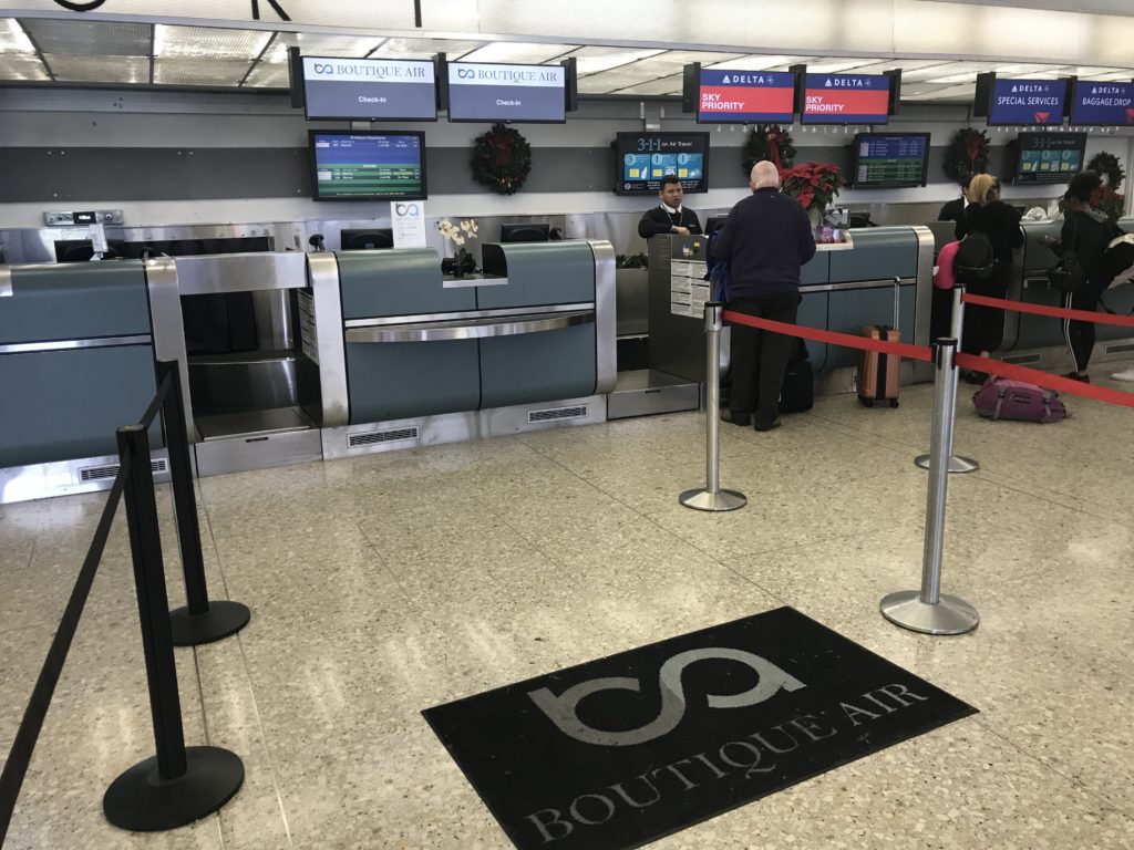 people standing in front of a check in counter