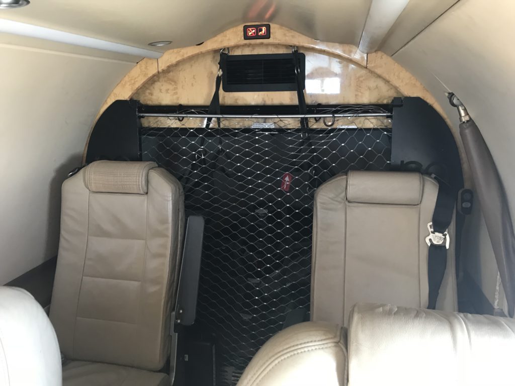 seats in an airplane with a net