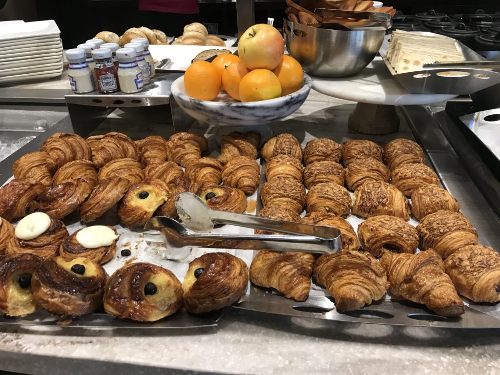 a tray of pastries and oranges