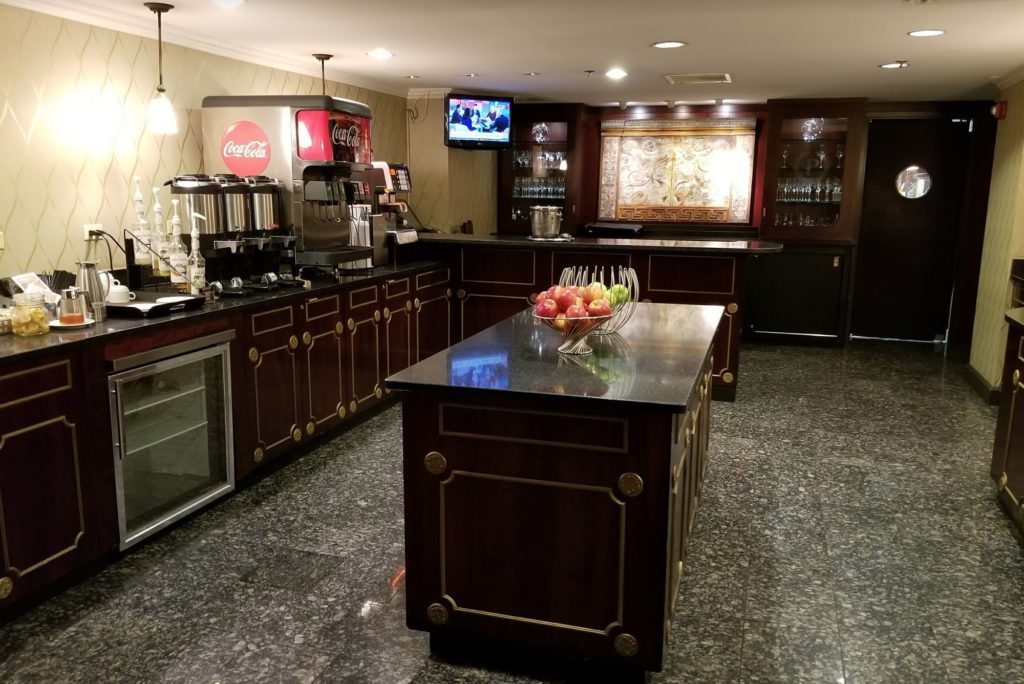 a kitchen with a counter top and a tv