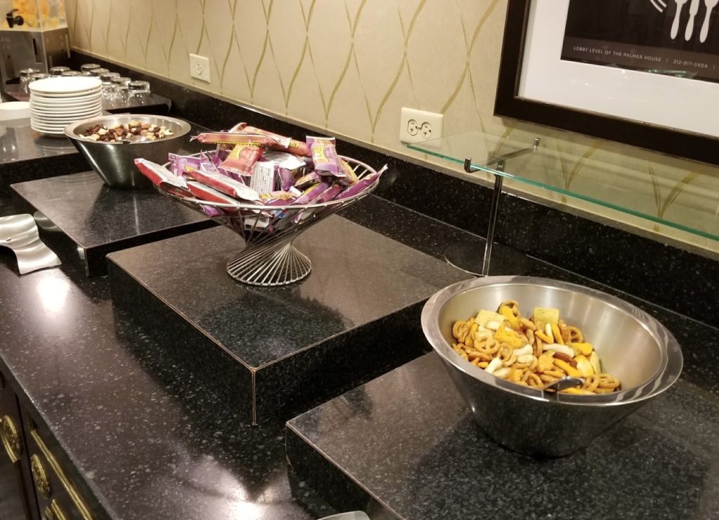 a group of bowls of snacks on a counter