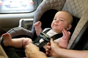 a baby in a car seat