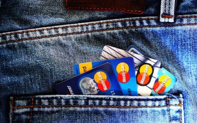 a group of credit cards in a pocket of jeans