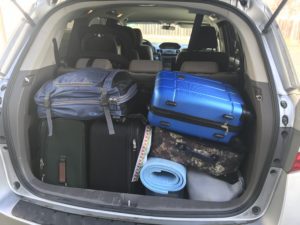 a car with luggage in the back
