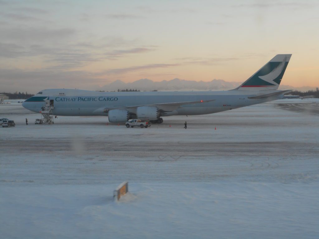 a large airplane on a snowy runway