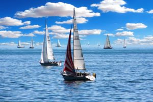 a group of sailboats in the water