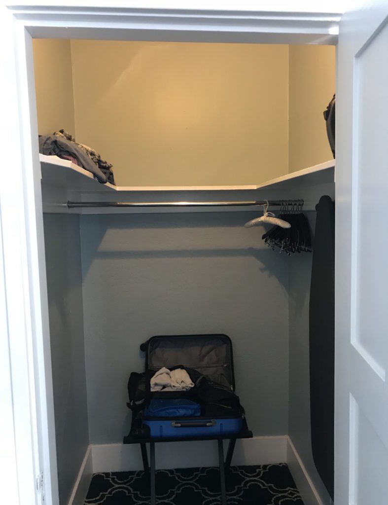 a suitcase in a closet