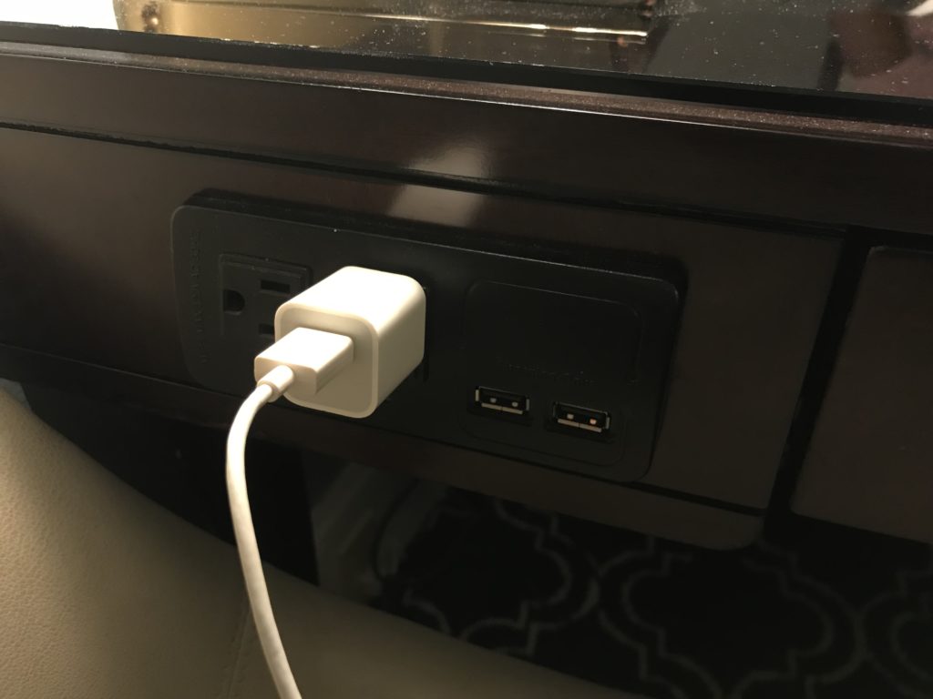 a white cord plugged into a outlet