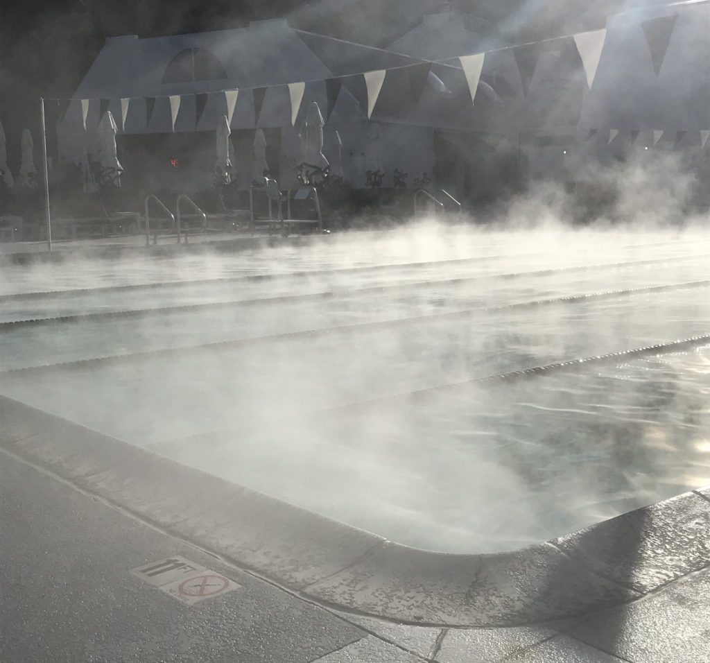 a pool with steam coming out of it