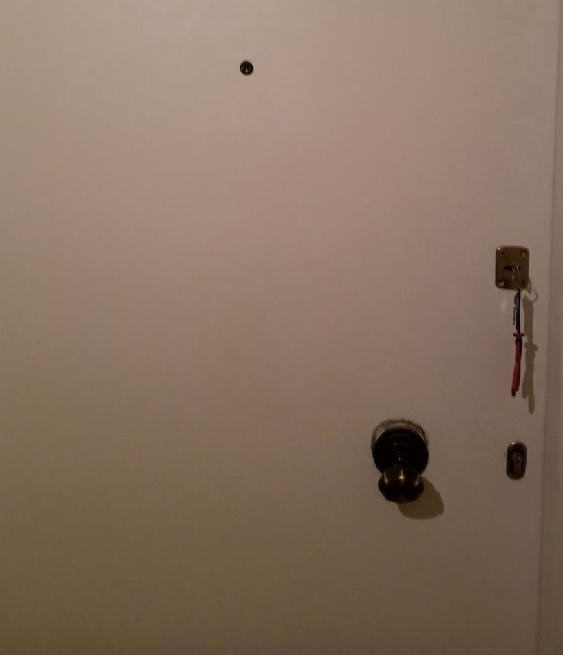 a door with a key and a doorknob