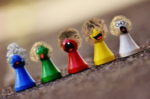 a group of colorful figurines with different faces