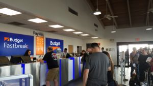 people standing in a line at a cash desk
