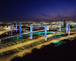 a city at night with many pillars