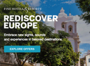 a white building with a bell tower in the background