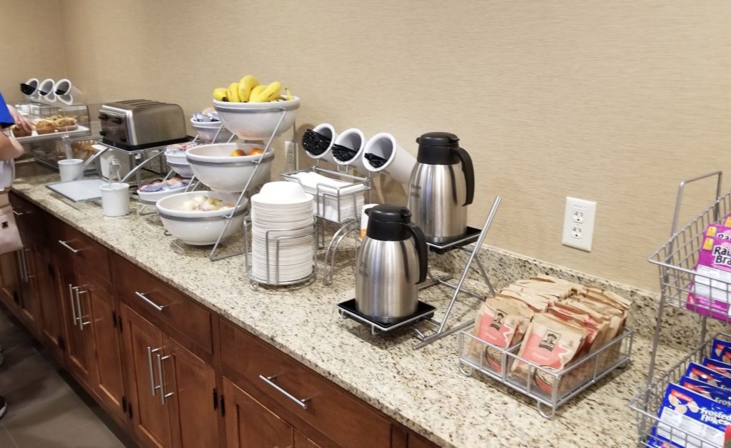 a buffet table with food and coffee