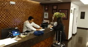 a man and woman at a hotel reception