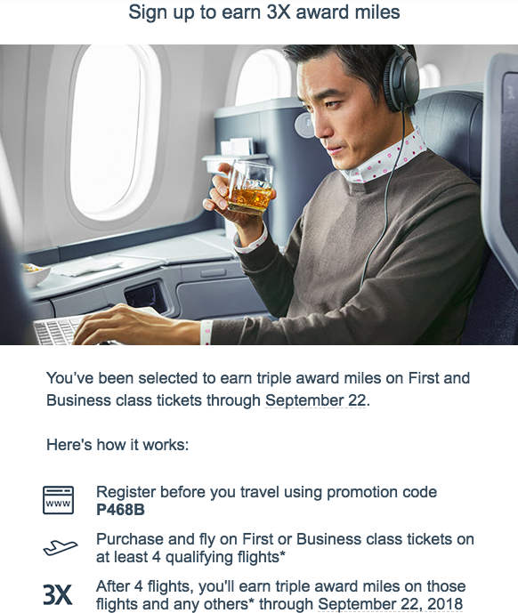 a man sitting in an airplane holding a drink