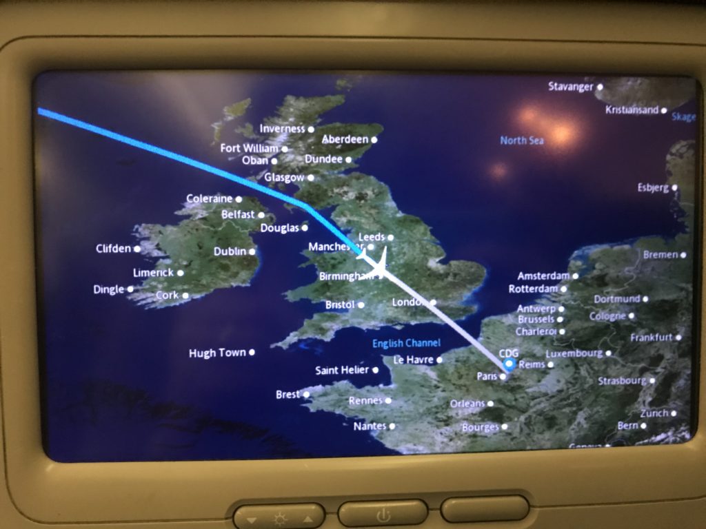 a map of the world with a plane flying